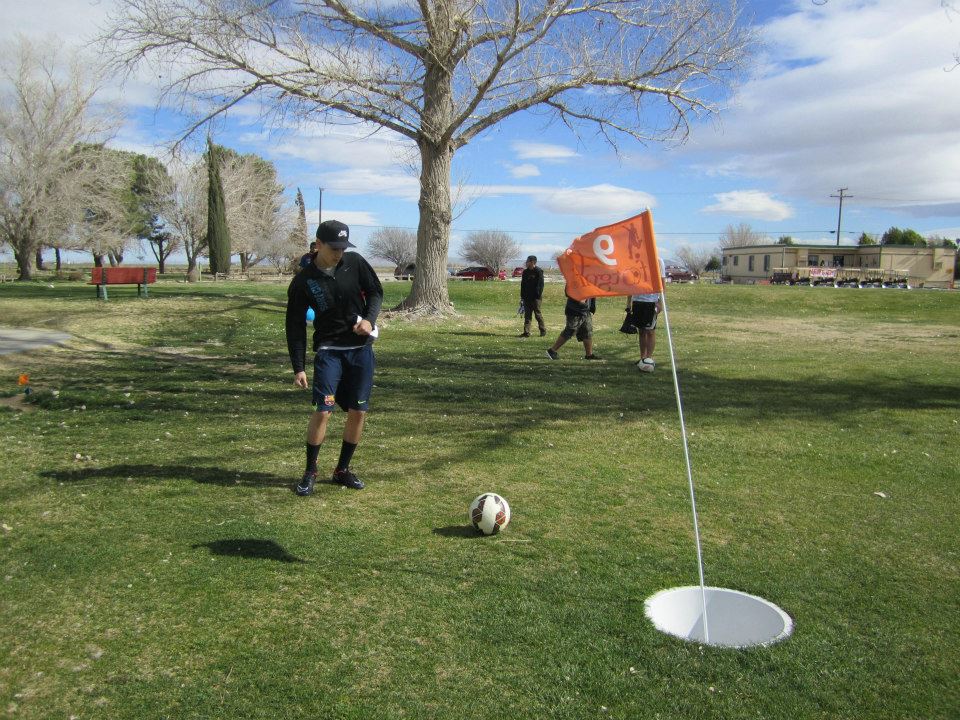 Gentleman playing footgolf in winter 